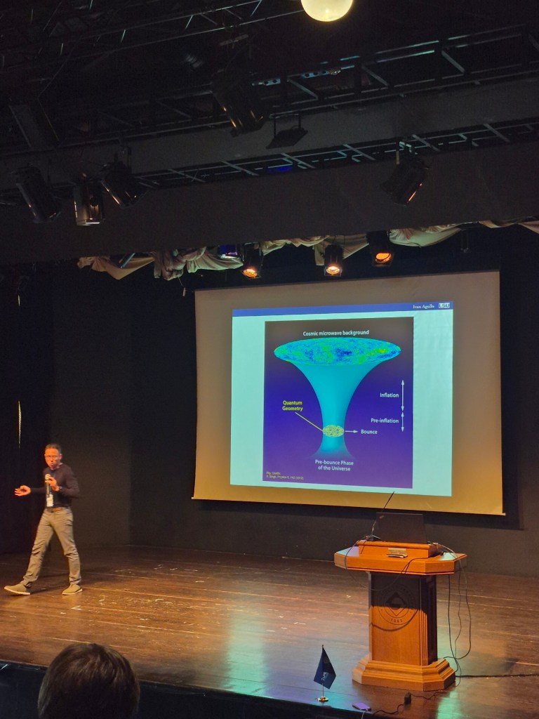 A speaker presenting a quantum gravity and cosmology talk during QGIST 2026 at Boğaziçi University.